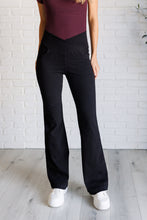 Load image into Gallery viewer, Building Habits Twill Flared Crossover Waist Pant in Black